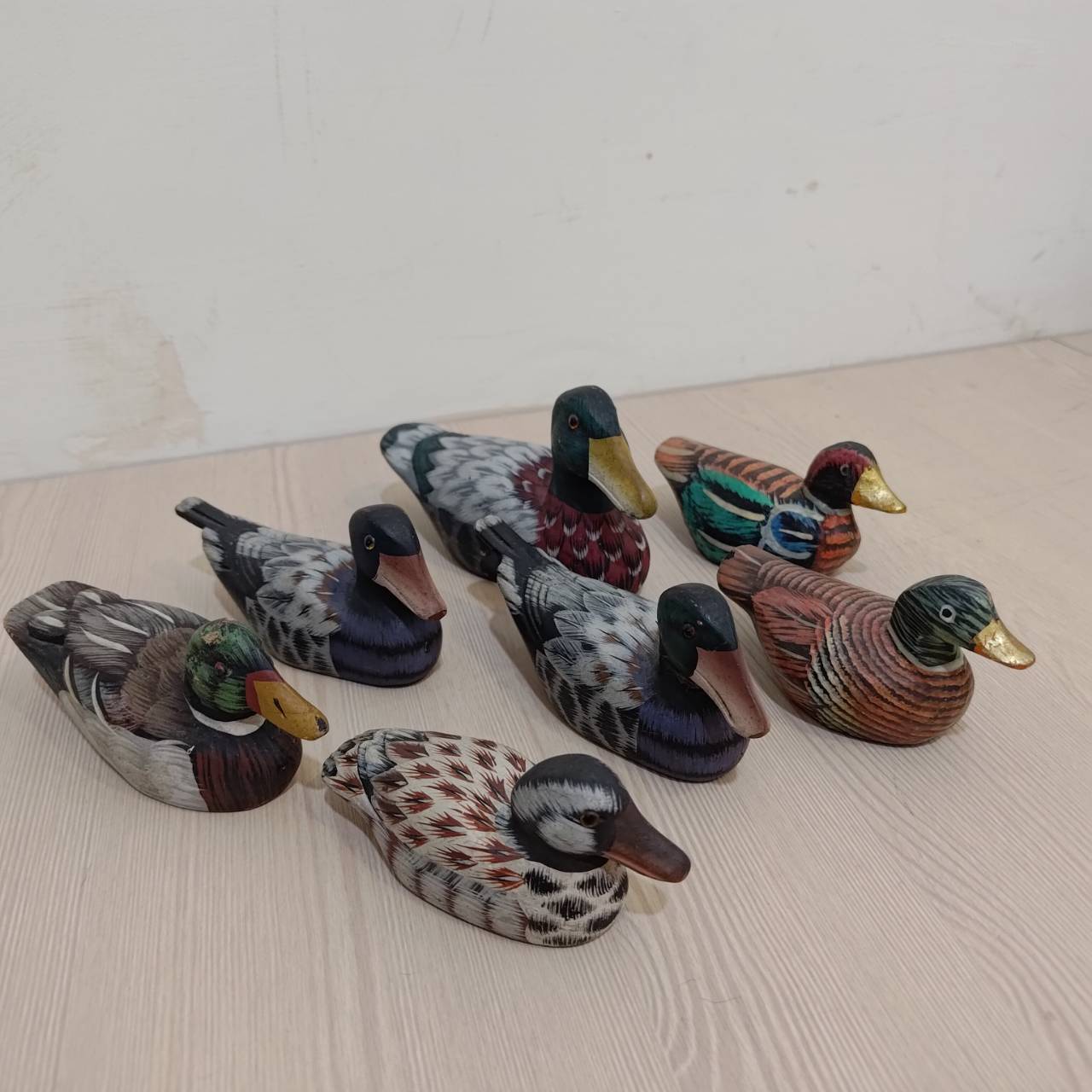 Smaller, handmade and hand-painted wooden ducks